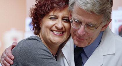 A patient hugging a doctor.