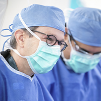 AHN surgeons wearing PPE during a surgery.