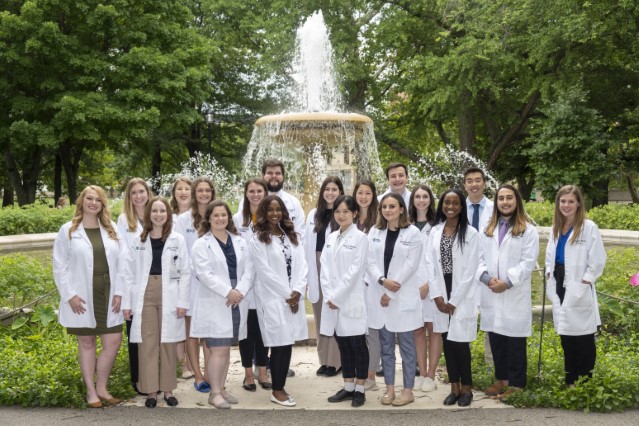 image of AHN Pharmacy Residents in front of the Northeast Fountain in Allegheny Commons Park