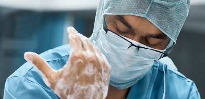 image of an ER doctor washing his hands
