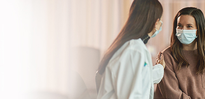 AHN oncologist Christie Hilton and colleague having an in-depth conversation with a patient.
