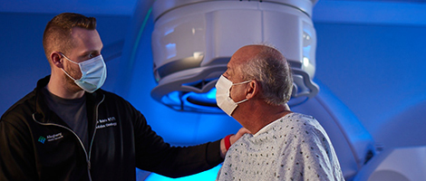 An AHN nurse navigator offering comfort to a patient during his test.